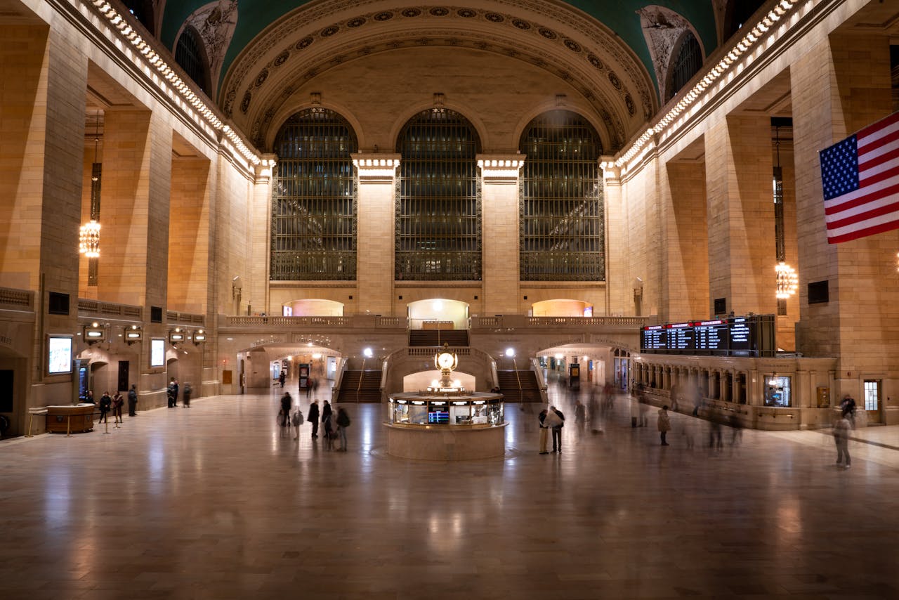about-04 Grand Central Terminal's vast interior captured at night, highlighting its architectural grandeur and bustling atmosphere.