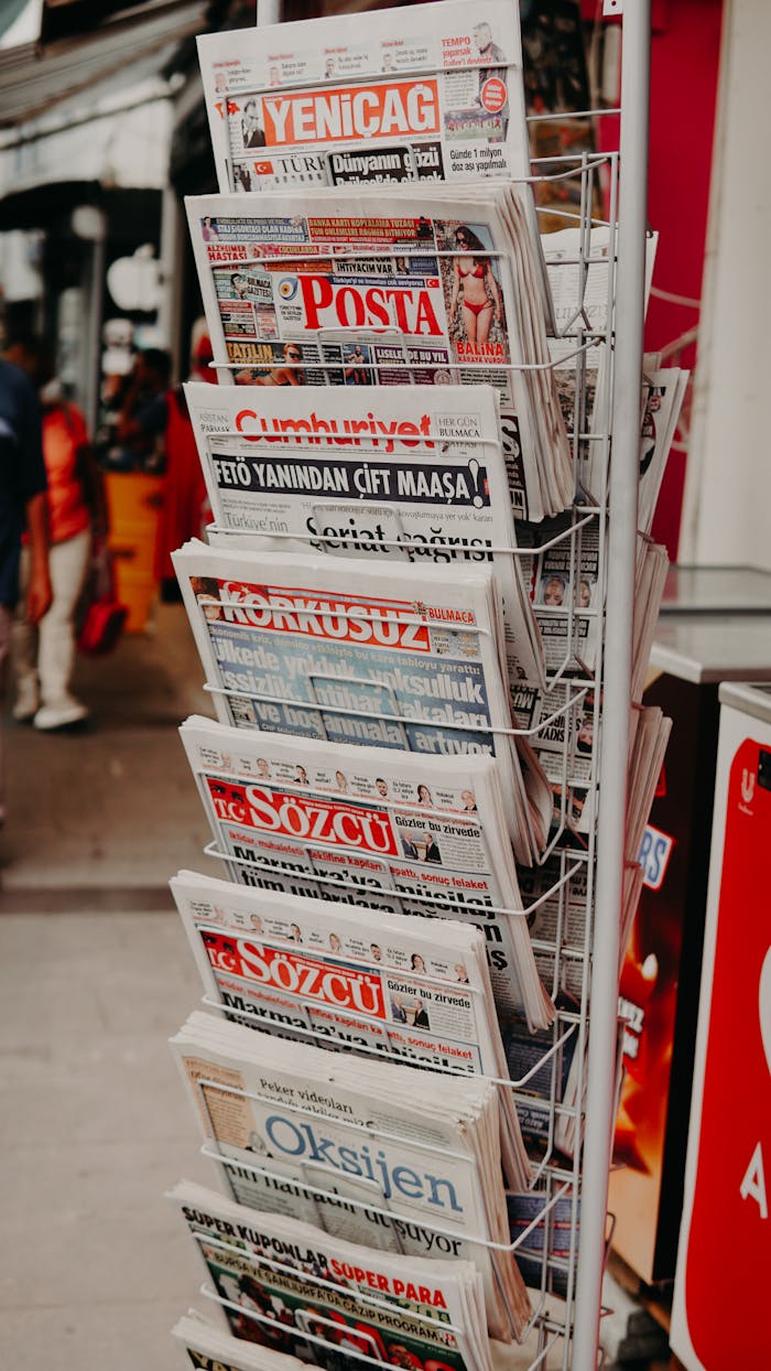 Home Close-up of various Turkish newspapers on a street stand, capturing daily life.